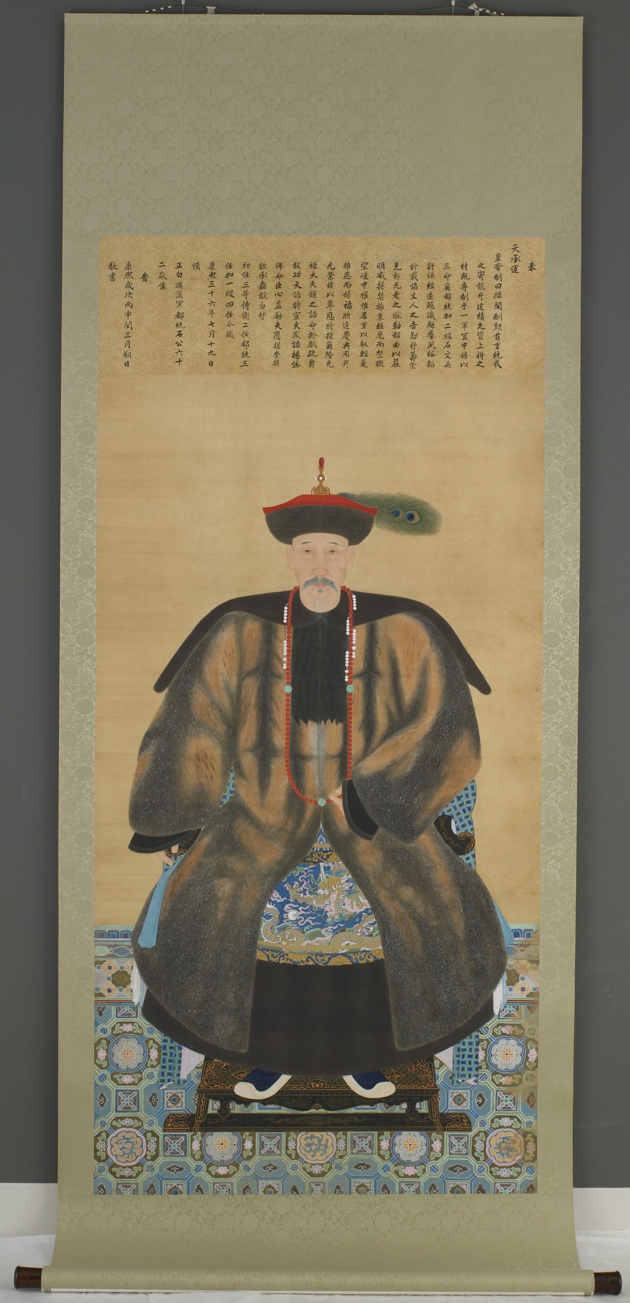 painting of a man sitting in a chair with fine clothes