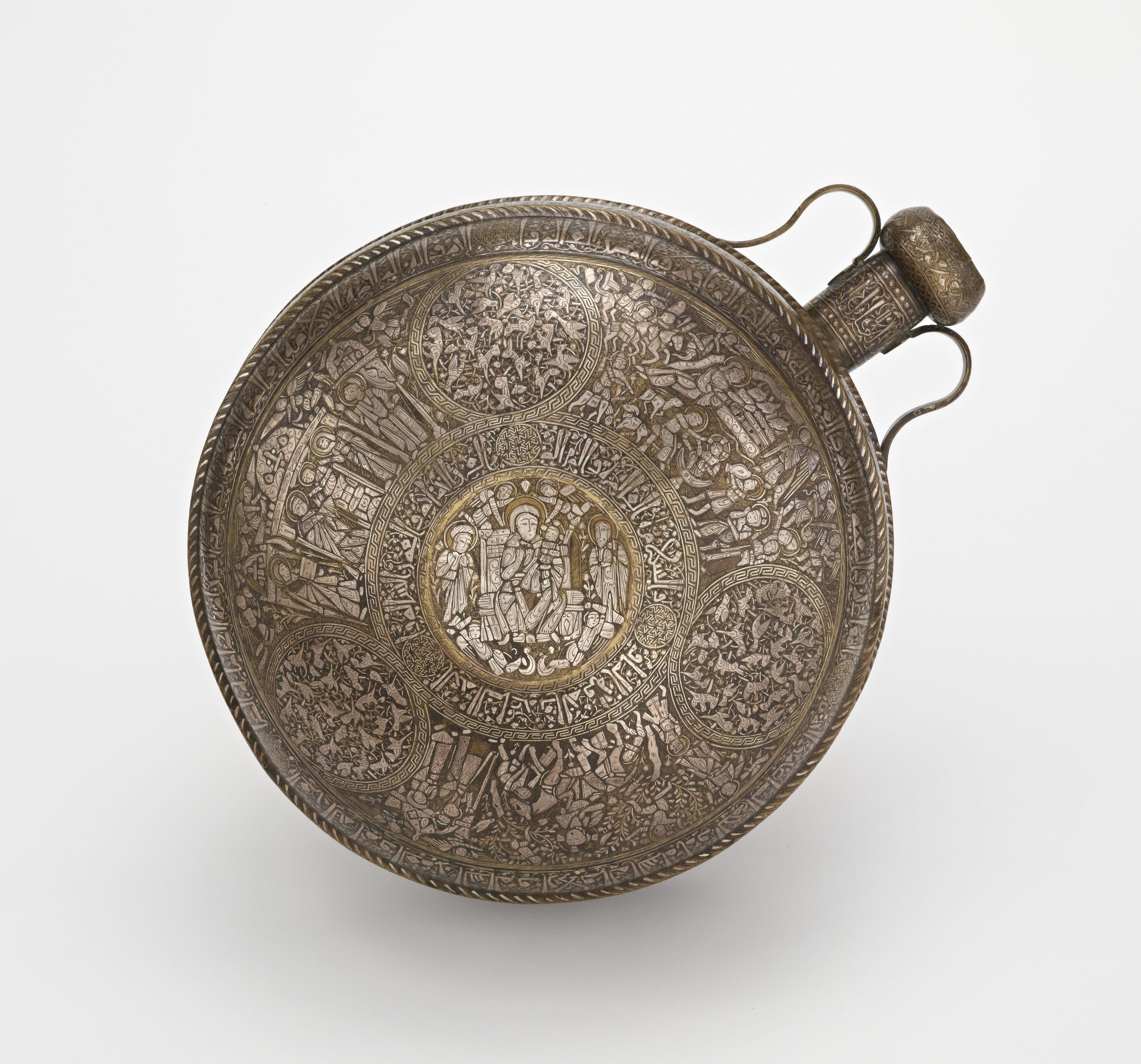 image of a metal canteen with inlaid silver